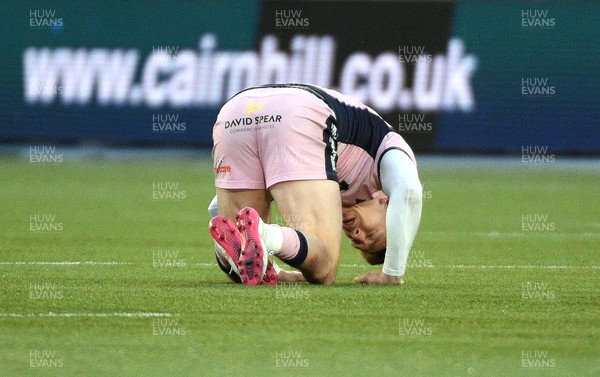 080526 - Glasgow Warriors v Cardiff Rugby - United Rugby Championship - Josh Adams of Cardiff lays unconcussed after a hard collison with Sione Tuipulotu