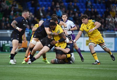 111025 - Glasgow Warriors v Dragons RFC - United Rugby Championship - Levi Douglas of Dragons barges through the tackle of Alex Craig of Glasgow Warriors