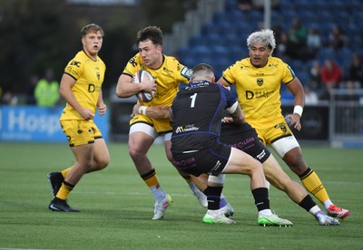 111025 - Glasgow Warriors v Dragons RFC - United Rugby Championship - Harri Ackerman of Dragons tackled by Sione Tuipulotu of Glasgow Warriors and Rory Sutherland of Glasgow Warriors (1)