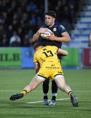 111025 - Glasgow Warriors v Dragons RFC - United Rugby Championship - Adam Hastings of Glasgow Warriors tackled by Aneurin Owen of Dragons (13)