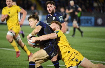 111025 - Glasgow Warriors v Dragons RFC - United Rugby Championship - Jamie Dobie of Glasgow Warriors tackled by Aneurin Owen of Dragons