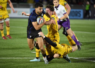 111025 - Glasgow Warriors v Dragons RFC - United Rugby Championship - Ben Afshar of Glasgow Warriors is hauled down by the Dragons defence