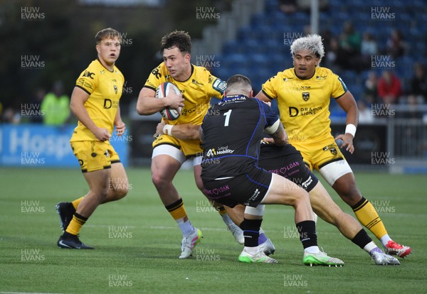 111025 - Glasgow Warriors v Dragons RFC - United Rugby Championship - Harri Ackerman of Dragons tackled by Sione Tuipulotu of Glasgow Warriors and Rory Sutherland of Glasgow Warriors (1)
