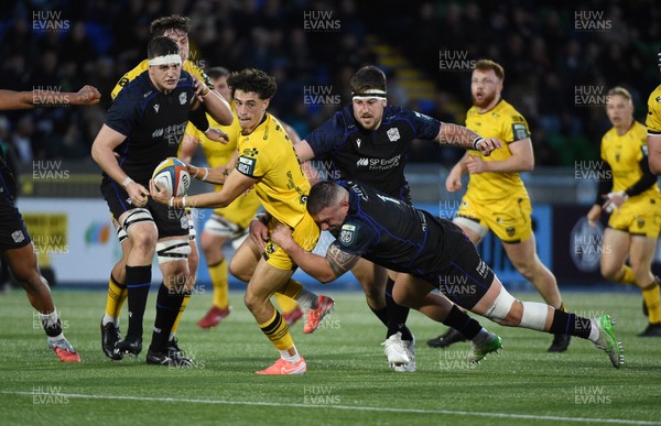 111025 - Glasgow Warriors v Dragons RFC - United Rugby Championship - Che Hope of Dragons tackled by Rory Sutherland of Glasgow Warriors