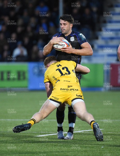 111025 - Glasgow Warriors v Dragons RFC - United Rugby Championship - Adam Hastings of Glasgow Warriors tackled by Aneurin Owen of Dragons (13)