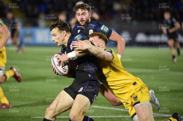 111025 - Glasgow Warriors v Dragons RFC - United Rugby Championship - Jamie Dobie of Glasgow Warriors tackled by Aneurin Owen of Dragons