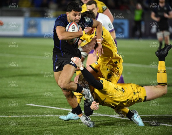 111025 - Glasgow Warriors v Dragons RFC - United Rugby Championship - Ben Afshar of Glasgow Warriors is hauled down by the Dragons defence