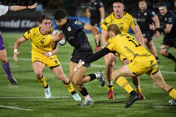 111025 - Glasgow Warriors v Dragons RFC - United Rugby Championship - Ben Afshar of Glasgow Warriors breaks through the Dragons defence of Niall Armstrong of Dragons (L) and David Richards of Dragons (11)