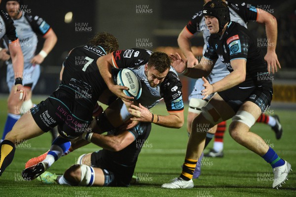 170224 - Glasgow Warriors v Dragons RFC - United Rugby Championship - Sean Lonsdale of Dragons is tackled by Thomas Gordon