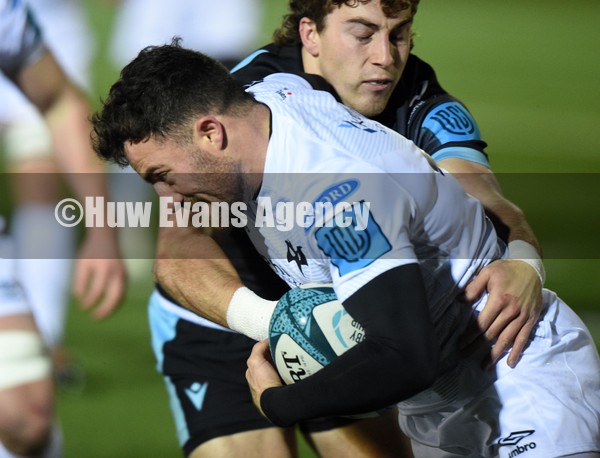 080122 - Glasgow Warriors v Ospreys - United Rugby Championship - Luke Morgan of Ospreys is tackled by Josh McKay of Glasgow