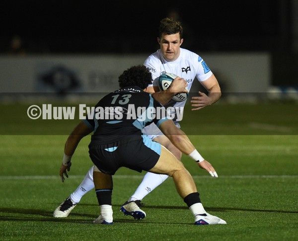 080122 - Glasgow Warriors v Ospreys - United Rugby Championship - Mike Collins of Ospreys takes on opposite number Sione Tuipulotu