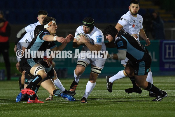 080122 - Glasgow Warriors v Ospreys - United Rugby Championship - Morgan Morris of Ospreys drives into Rory Darge (L) and Zander Fagerson