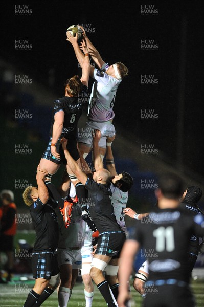 120321 - Glasgow Warriors v Ospreys - Guinness PRO14 - Will Griffiths of Ospreys wins a line out against opposite number Rob Harley