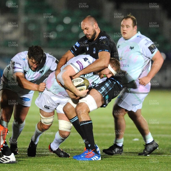 120321 - Glasgow Warriors v Ospreys - Guinness PRO14 - Will Griffiths of Ospreys is tackled by Kian McDonald of Glasgow