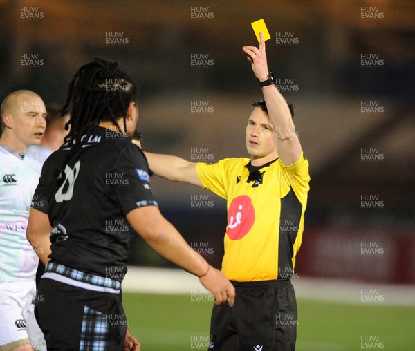 120321 - Glasgow Warriors v Ospreys - Guinness PRO14 - TJ Loane of Glasgow is shown the yellow card by referee Sam Grove-White