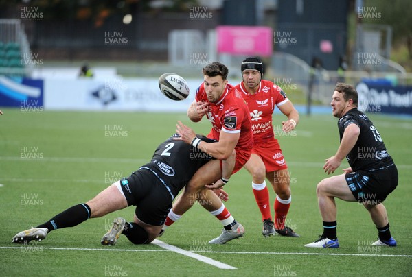 111020 - Glasgow Warriors v Scarlets - Guinness PRO14 - Johnny Williams of Scarlets spills the ball as he is tackled by Fraser Brown