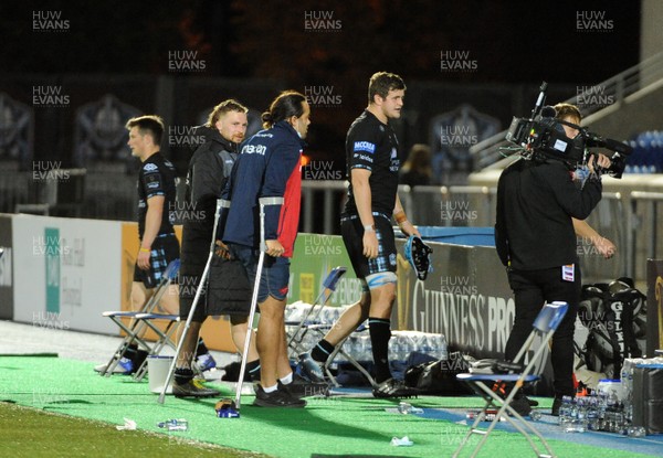 111020 - Glasgow Warriors v Scarlets - Guinness PRO14 - Josh MacLeod of Scarlets leaves the field on crutches at the end of the match
