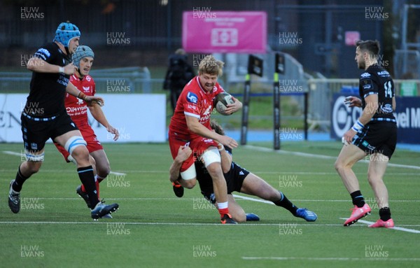111020 - Glasgow Warriors v Scarlets - Guinness PRO14 - James Davies of Scarlets is tackled down by Stafford McDowall