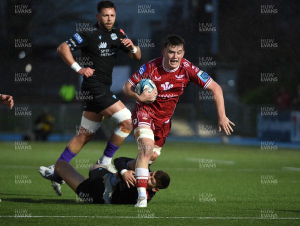 140423 - Glasgow Warriors v Scarlets - United Rugby Championship - Josh Macleod of Scarlets is tackled by Tom Jordan of Glasgow