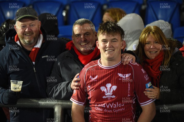 140423 - Glasgow Warriors v Scarlets - United Rugby Championship - Iwan Shenton of Scarlets celebrates making his debut with (L to R) his father, uncle and mother