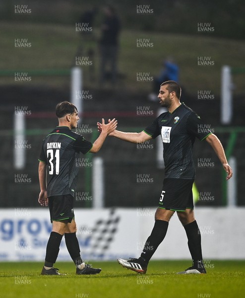 080721 Glentoran v The New Saints, UEFA Europa Conference League First Qualifying Round First Leg - Thomas Williams, left, and Ryan Astles of The New Saints shake hands at the end of the match