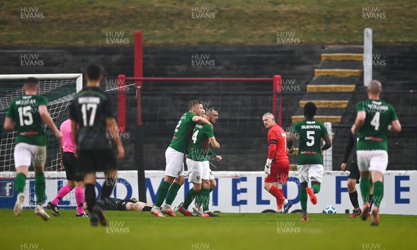 080721 Glentoran v The New Saints, UEFA Europa Conference League First Qualifying Round First Leg - Paul Harrison of The New Saints looks on as Jamie McDonagh of Glentoran celebrates after scoring his side's first goal