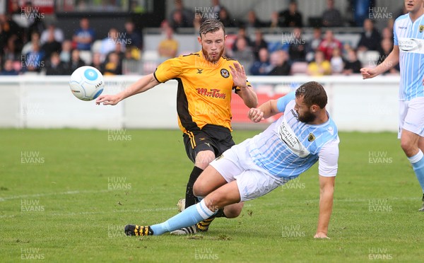 220717 - Gloucester City v Newport County - Pre Season Friendly - Mark O'Brien of Newport County is tackled by Sam Avery of Gloucester