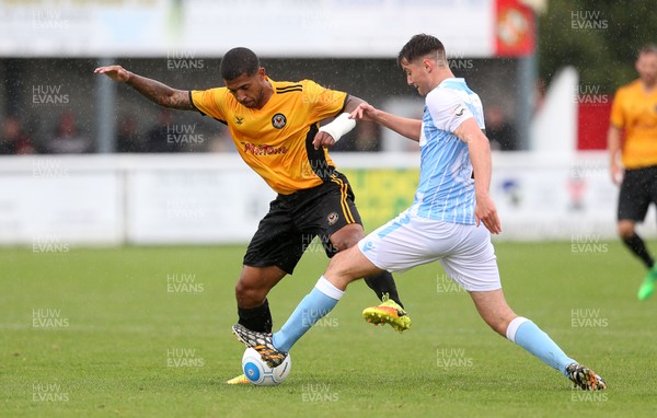 220717 - Gloucester City v Newport County - Pre Season Friendly - Joss Labadie of Newport County is tackled by Joe Hanks of Gloucester