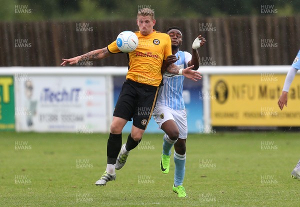 220717 - Gloucester City v Newport County - Pre Season Friendly - Scot Bennett of Newport County is challenged by Edjija Mbunga