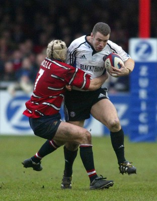 080203 - Gloucester v Bath - Zurich Premiership - Bath Centre Kevin Maggs tries to break through the tackle from Gloucester flanker Andy Hazell