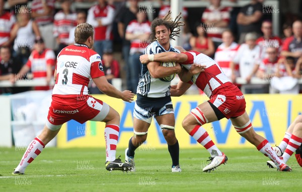 180812 - Gloucester Rugby v Cardiff Blues, Pre-season Friendly - Cardiff Blues Josh Navidi is tackled by Gloucester's Rupert Harden and Will James