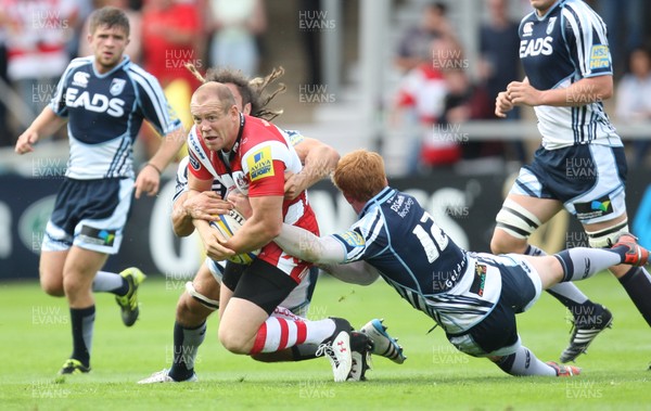 180812 - Gloucester Rugby v Cardiff Blues, Pre-season Friendly - Gloucester's Mike Tindall is tackled by Cardiff Blues Josh Navidi and Cardiff Blues Rhys Patchell  