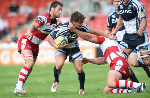 180812 - Gloucester Rugby v Cardiff Blues, Pre-season Friendly - Cardiff Blues Harry Robinson is tackled by Gloucester's Matt Cox and Gloucester's Nick Wood