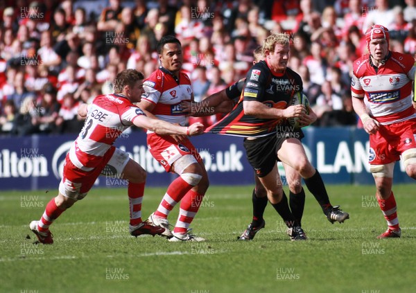 13.03.11 Gloucester v Dragons - LV=Cup Semi-final - Dragons' Pat Leach escapes the tackle of Gloucester's Henry Trinder. 