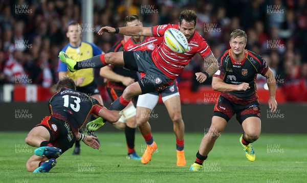230818 - Gloucester Rugby v Dragons - Pre Season Friendly - Danny Cipriani of Gloucester is tackled by Tyler Morgan of Dragons