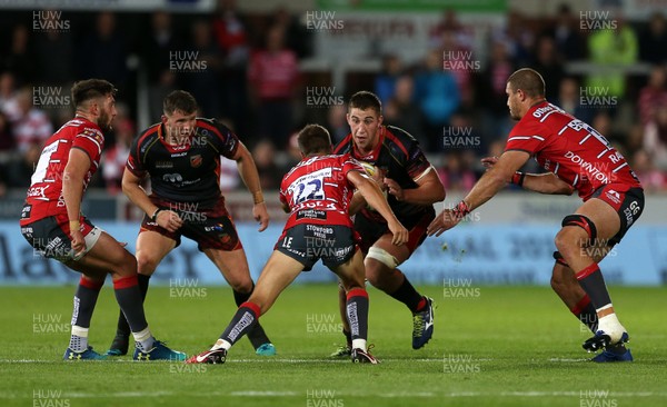 230818 - Gloucester Rugby v Dragons - Pre Season Friendly - Huw Taylor of Dragons is tackled by Lloyd Evans of Gloucester
