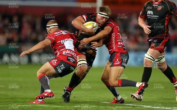 230818 - Gloucester Rugby v Dragons - Pre Season Friendly - Nic Cudd of Dragons is tackled by Lloyd Evans of Gloucester