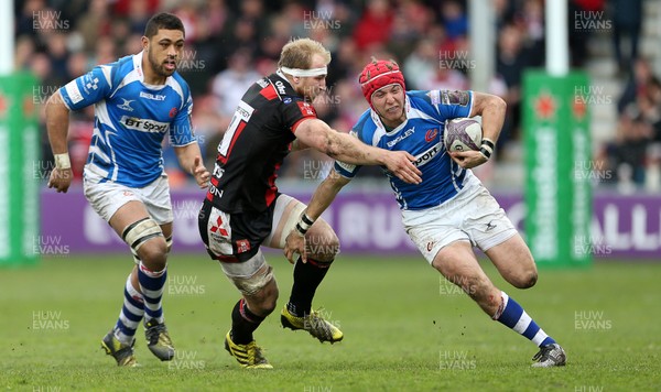 090416 - Gloucester v Newport Gwent Dragons - European Rugby Challenge Cup Quarter Final - Tyler Morgan of Newport Gwent Dragons is tackled by Matt Kvesic of Gloucester