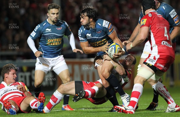 300813 - Gloucester v Scarlets - Preseason Friendly -Scarlets Gareth Owen tries to break the Gloucester defence