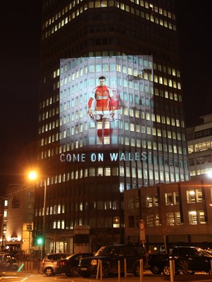 14.10.11 -  Good luck messages are projected onto the side Admiral's offices in Cardiff ahead of Wales' Rugby World Cup Semi Final against France 