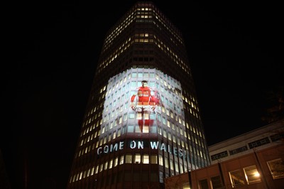 14.10.11 -  Good luck messages are projected onto the side Admiral's offices in Cardiff ahead of Wales' Rugby World Cup Semi Final against France 