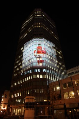 14.10.11 -  Good luck messages are projected onto the side Admiral's offices in Cardiff ahead of Wales' Rugby World Cup Semi Final against France 