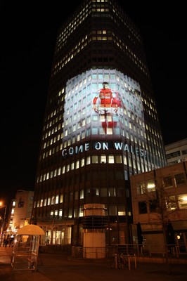 14.10.11 -  Good luck messages are projected onto the side Admiral's offices in Cardiff ahead of Wales' Rugby World Cup Semi Final against France 