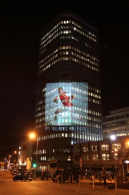 14.10.11 -  Good luck messages are projected onto the side Admiral's offices in Cardiff ahead of Wales' Rugby World Cup Semi Final against France 