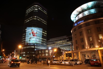 14.10.11 -  Good luck messages are projected onto the side Admiral's offices in Cardiff ahead of Wales' Rugby World Cup Semi Final against France 