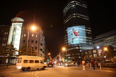 14.10.11 -  Good luck messages are projected onto the side Admiral's offices in Cardiff ahead of Wales' Rugby World Cup Semi Final against France 