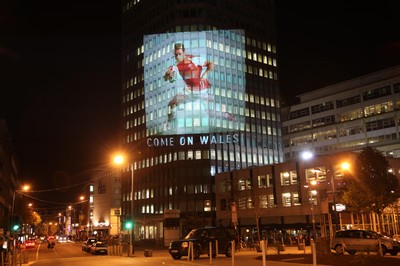 14.10.11 -  Good luck messages are projected onto the side Admiral's offices in Cardiff ahead of Wales' Rugby World Cup Semi Final against France 