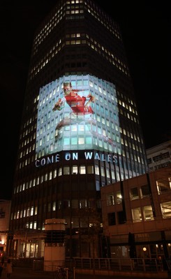 14.10.11 -  Good luck messages are projected onto the side Admiral's offices in Cardiff ahead of Wales' Rugby World Cup Semi Final against France 