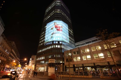 14.10.11 -  Good luck messages are projected onto the side Admiral's offices in Cardiff ahead of Wales' Rugby World Cup Semi Final against France 
