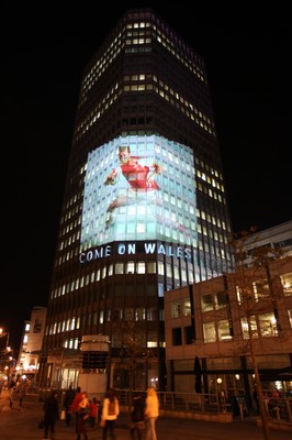 14.10.11 -  Good luck messages are projected onto the side Admiral's offices in Cardiff ahead of Wales' Rugby World Cup Semi Final against France 